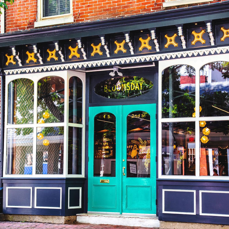A store front with blue doors