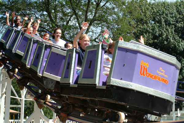 people riding roller coaster