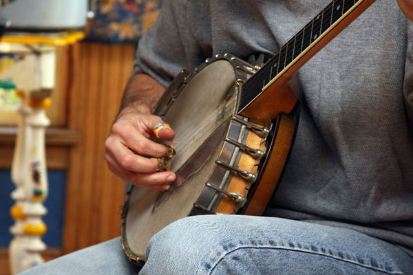 A person playing a Banjo