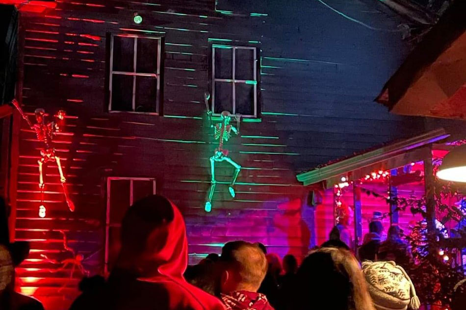 Skeletons hanging on Haunted House