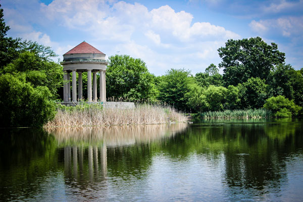 A pond with a building in the background