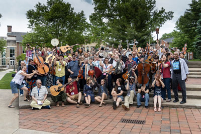 group of people holding instruments in hands posing for photo