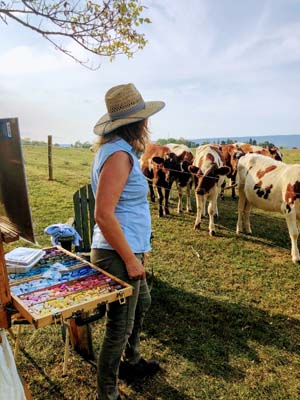 a woman looking at Cows at Farm