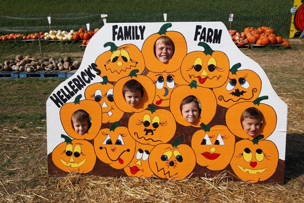 Kids posing for photo on pumpkin farm