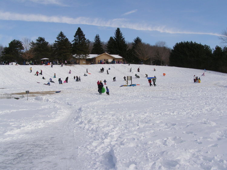 People sledding and tubing