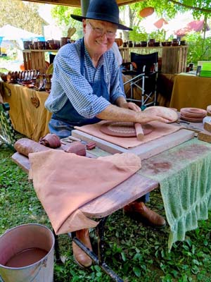 artist creating pottery