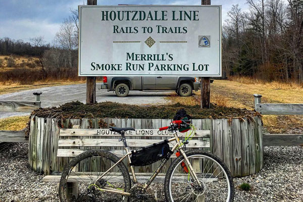 Houtzdale rail to trail signage bike parked next to it