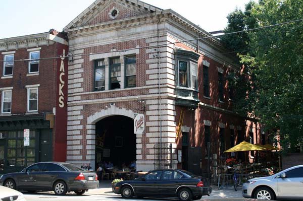 Car parked on street infront of Historic building Jack