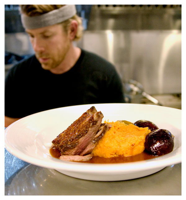 meat serving with mashed sweet potato in a plate