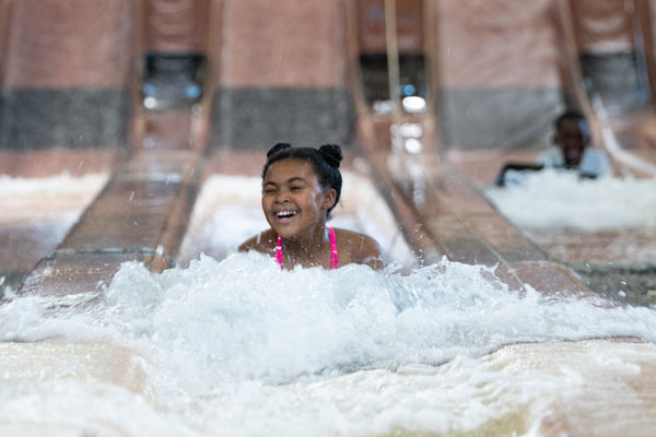 kid enjoying water slider