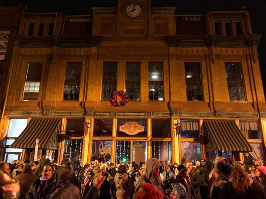 crowd gathered infront of Farmers Market building