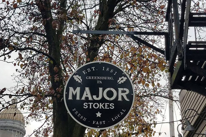 Major Stokes Business signage board hanging