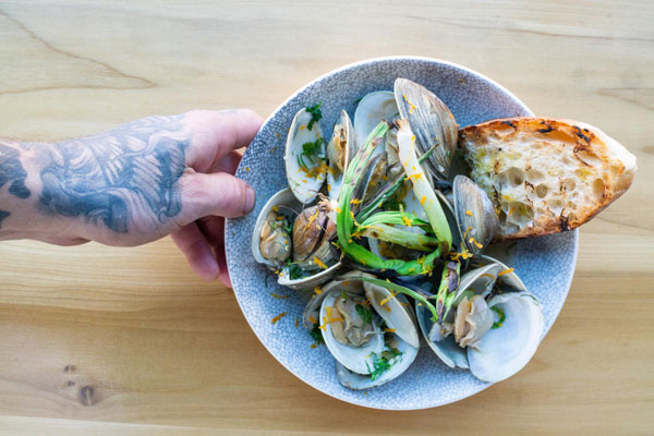 sea food shells served with a piece of bread