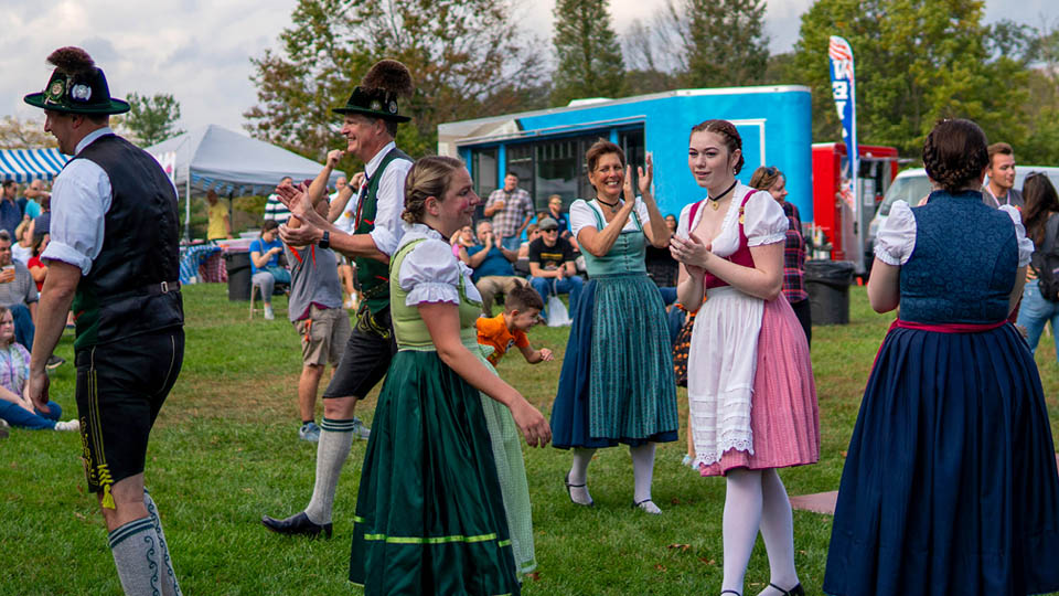 people dressed in bavarian costume