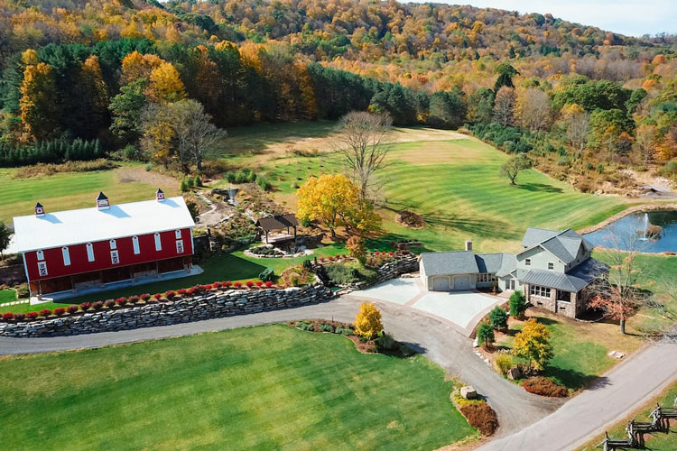 A Farmhouse with pond on side