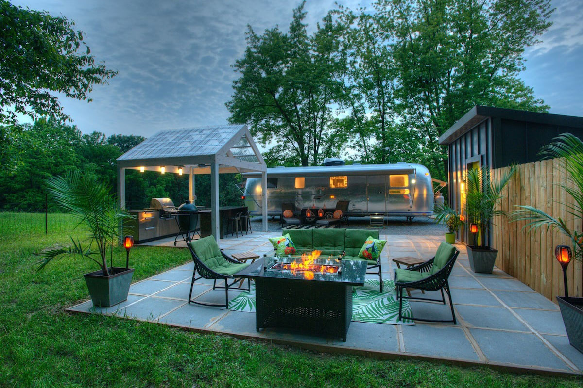 A house with a grill and a fire pit