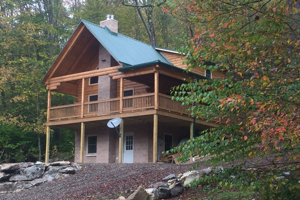 log cabin house by lake