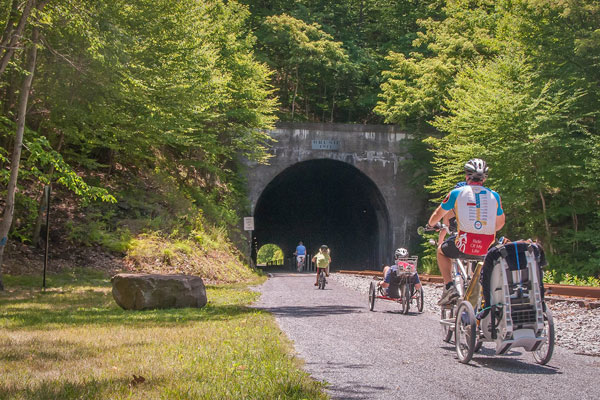 Family biking along rail trail