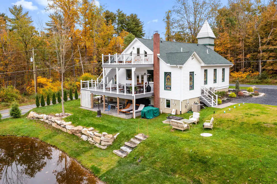 A house with a pond in the front