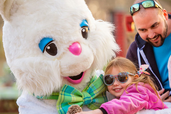 kid hugging a bunny