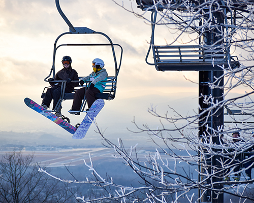 snowboarders on lift