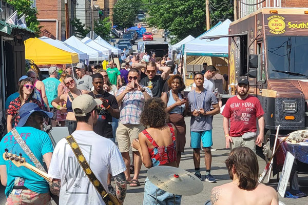 people walking around at millvale music festival
