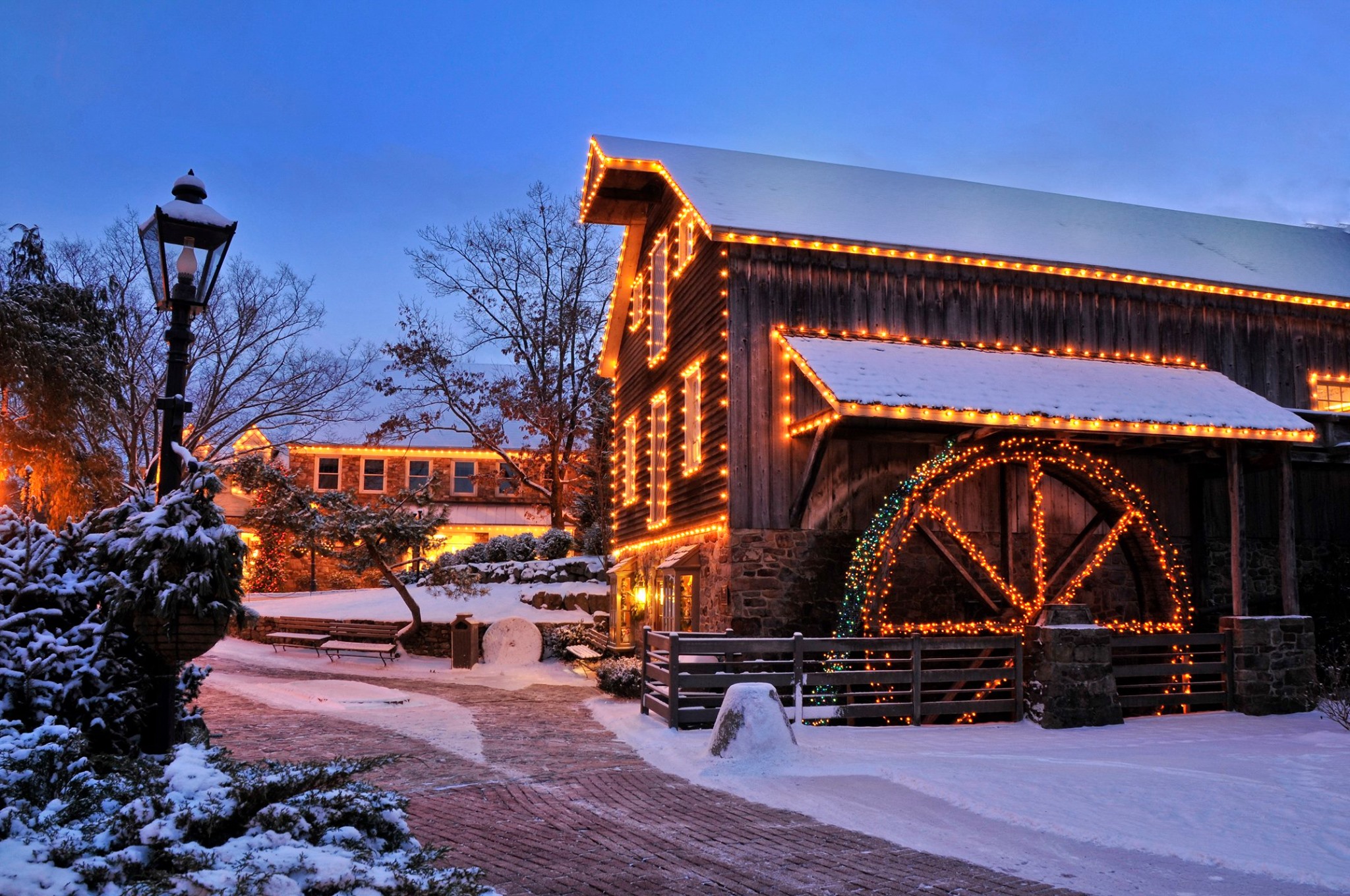 Farm with Holiday Lights covered under snow