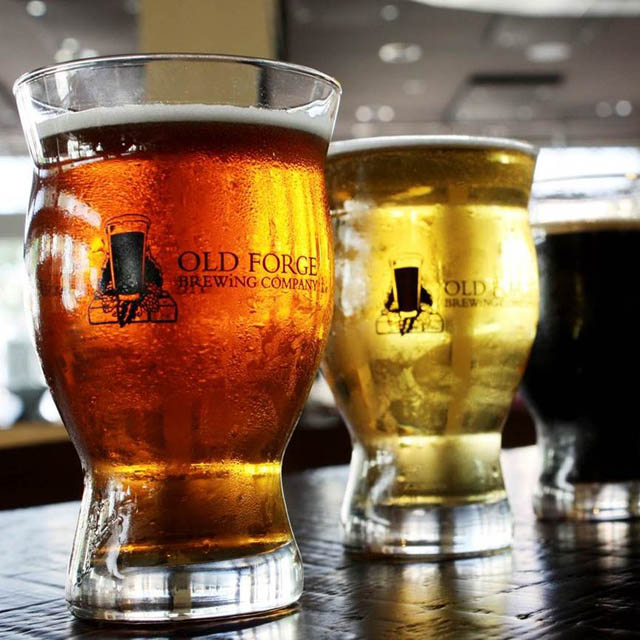 two beer glasses on table