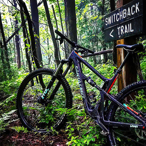 Biked parked to Trail Signage post