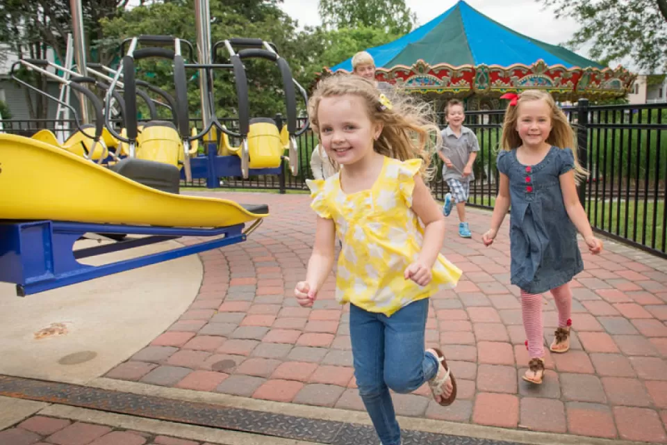 kids running around theme park