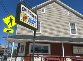 Exterior of an ice cream parlor with sign that reads Emingees