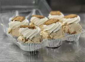 Container of half a dozen cupcakes