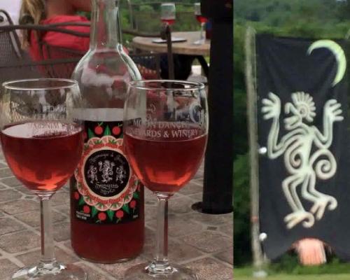 A photo of a wine bottle with two glasses of rose colored wine at Moon Dancer Vineyards and Winery in Pennsylvania