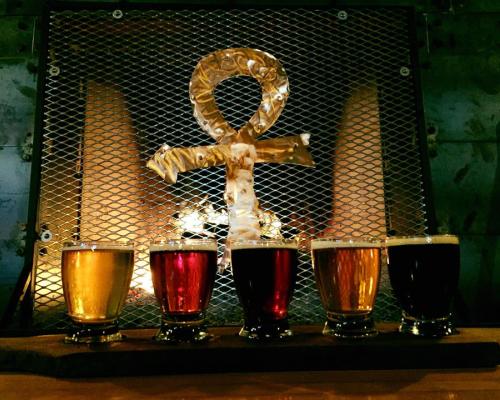 A photo of a flight of beers sitting on a bar at Mortals Key Brewing Company