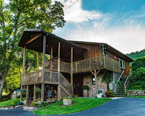 A photo of Mt. Nittany Winery, a rustic wood cabin looking building in Pennsylvania