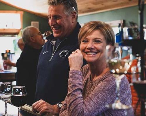 couple enjoying wine at seven Mountain Wine Cellars