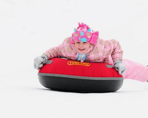 girl snow tubing