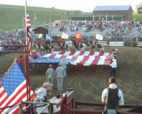 honoring american flag before rodeo