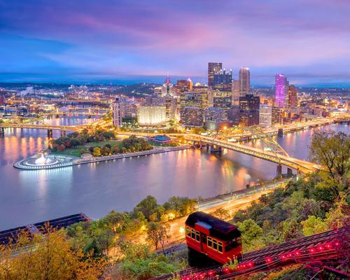 duquesne incline car with beautiful Pittsburgh Skyline view night under lights