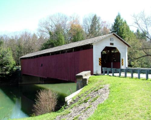 covered bridge over river creek