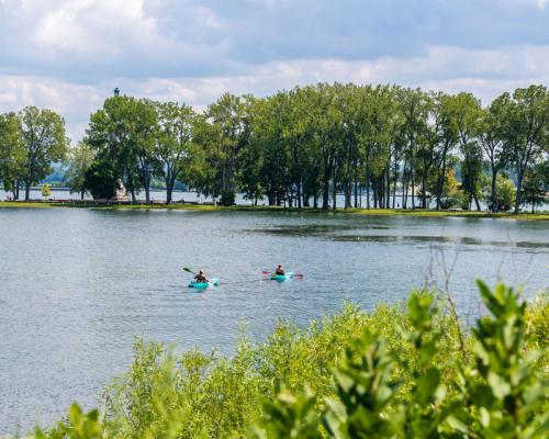 couple kayaking on lake lagoon