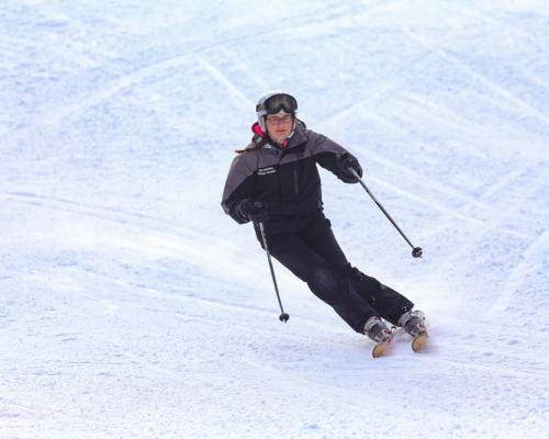 a guy skiing slopes