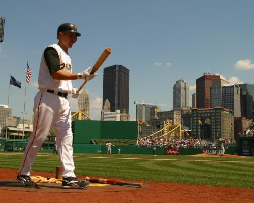 batter holding baseball bat in hands