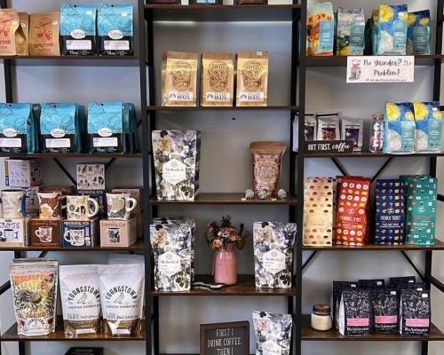 coffee bean bags and mugs assorted in shelf