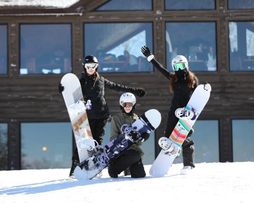 people posing with Snow boards