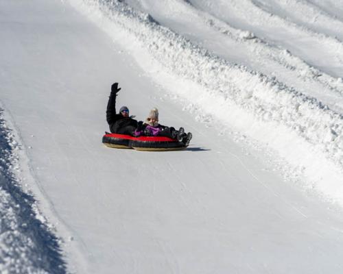 a person snowtubing