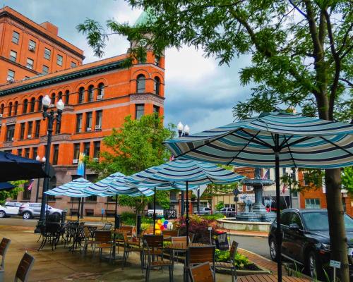 patio with umbrellas on a Main Street