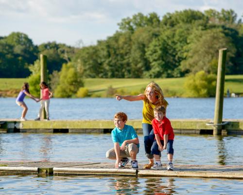family on dock by lake at core creek park
