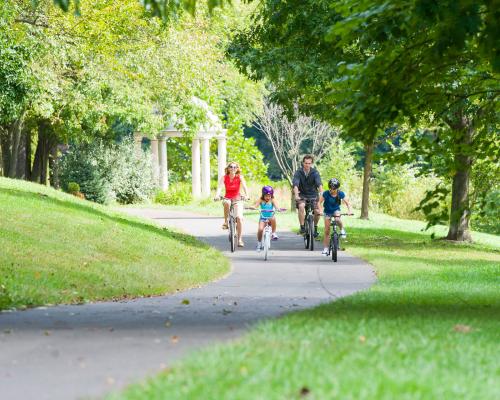 family biking on trail