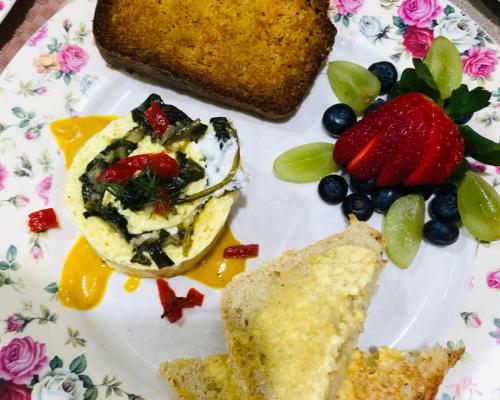 Breakfast with eggs fruits and toast